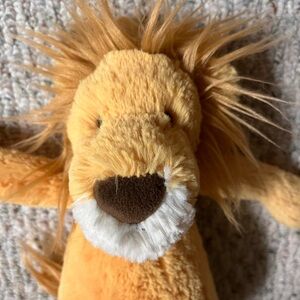 Jellycat Bashful Lion stuffed animal. Golden yellow plush fur caramel mane